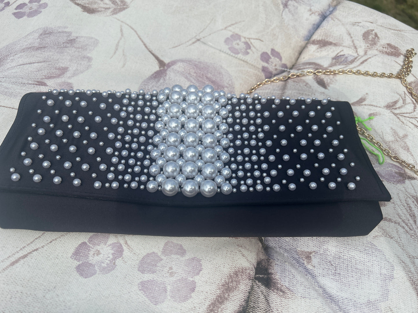 Long about town pearl and chain wallet bag